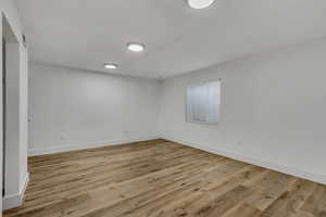 Unfurnished room with light hardwood / wood-style floors