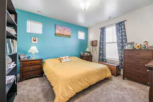 Primary Spacious Bedroom with Several Windows for Light