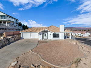 View of front facade featuring a garage