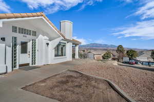 View of property exterior with a mountain view