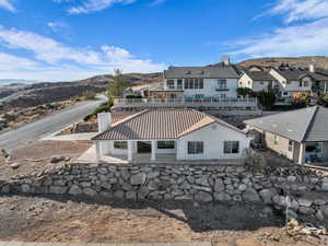 Back of property with a mountain view