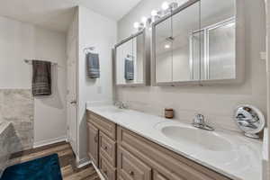 Bathroom featuring vanity and wood-type flooring