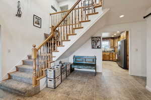 Staircase featuring sink