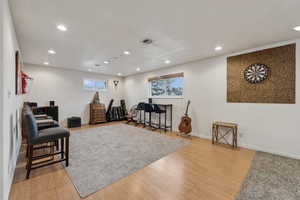 Exercise area featuring hardwood / wood-style flooring