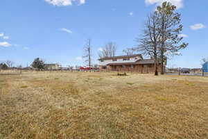 View of yard with a rural view