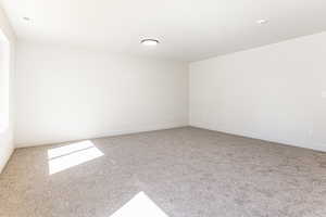 Empty room with carpet floors