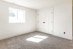 Unfurnished bedroom with carpet floors