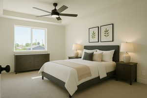 Bedroom featuring ceiling fan, a tray ceiling, and light colored carpet