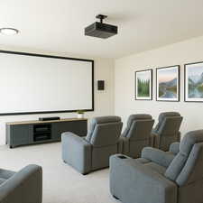Home theater with light colored carpet