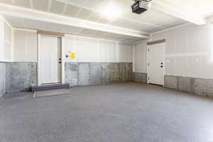 Garage featuring a garage door opener