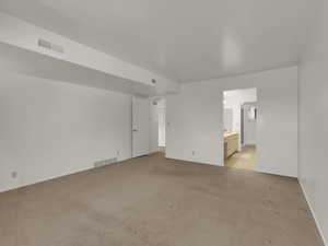 Primary bedroom looking into bathroom