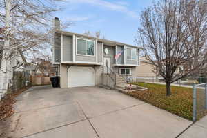 Bi-level home featuring a garage