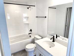 Full bathroom with tile patterned flooring, vanity, toilet, and tub / shower combination