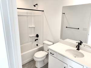 Full bathroom with shower / tub combination, vanity, and toilet