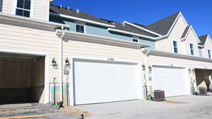 Garage featuring central air condition unit