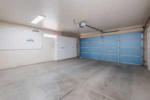 Garage featuring a garage door opener