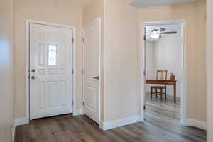 Foyer entrance with hardwood / wood-style flooring