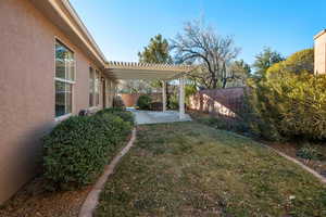 View of yard with a patio area and a pergola