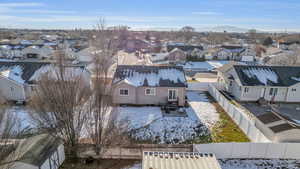 Snowy aerial view featuring a mountain view