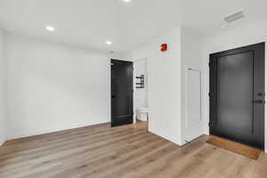 Spare room featuring light wood-type flooring