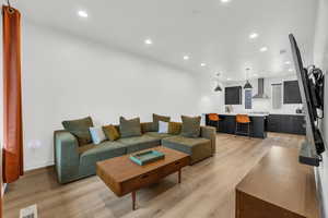 Living room with light wood-type flooring