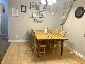 Dining area featuring wood-type flooring