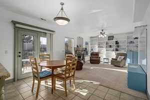 Dining area with patio door entrance and view of family room.