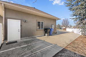 RV parking/ parking area with entrance to basement apartment.