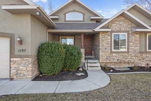 Property entrance featuring front porch with stair-heaters (included)