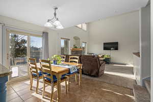 Dining room showing tile flooring and view into family room.