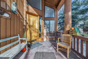 Property entrance with covered porch