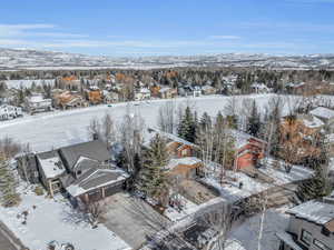 Snowy aerial view featuring a mountain view