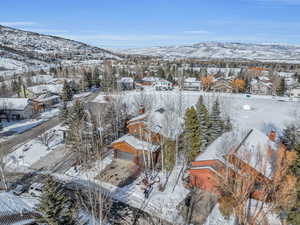 Snowy aerial view with a mountain view