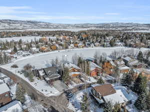 Snowy aerial view featuring a mountain view