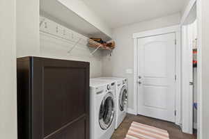 Laundry area with washer and dryer and a textured ceiling