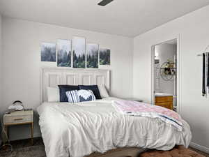 Carpeted bedroom with ceiling fan