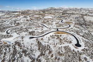 Snowy aerial view featuring a mountain view