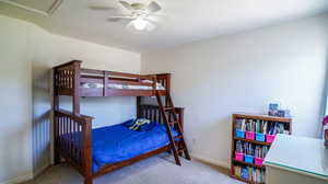 Bedroom featuring ceiling fan and carpet floors