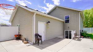 Back of house with a patio