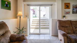 Walkout basement doorway with light tile patterned flooring