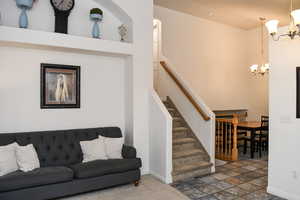 Living room featuring a notable chandelier