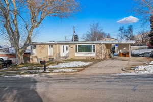 Ranch-style house with a carport