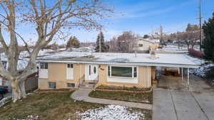 View of front of home with a carport