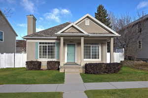 View of front facade with a front yard