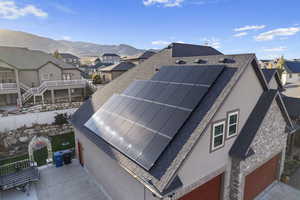 Exterior space with a mountain view and solar panels