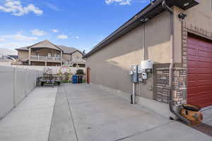 View of side of home featuring a garage