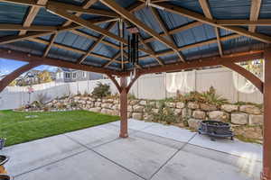 View of patio / terrace with a gazebo and a fire pit