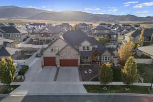 View of front of property featuring a mountain view and a garage