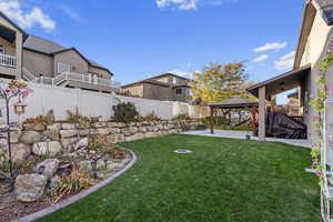 View of yard with a gazebo and a patio