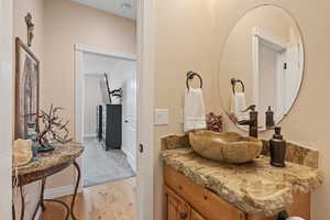 Bathroom featuring vanity and hardwood / wood-style flooring